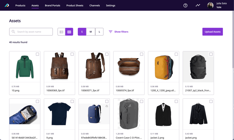 The Assets overview in PLytix PIM, showing a range of bags and clothes.