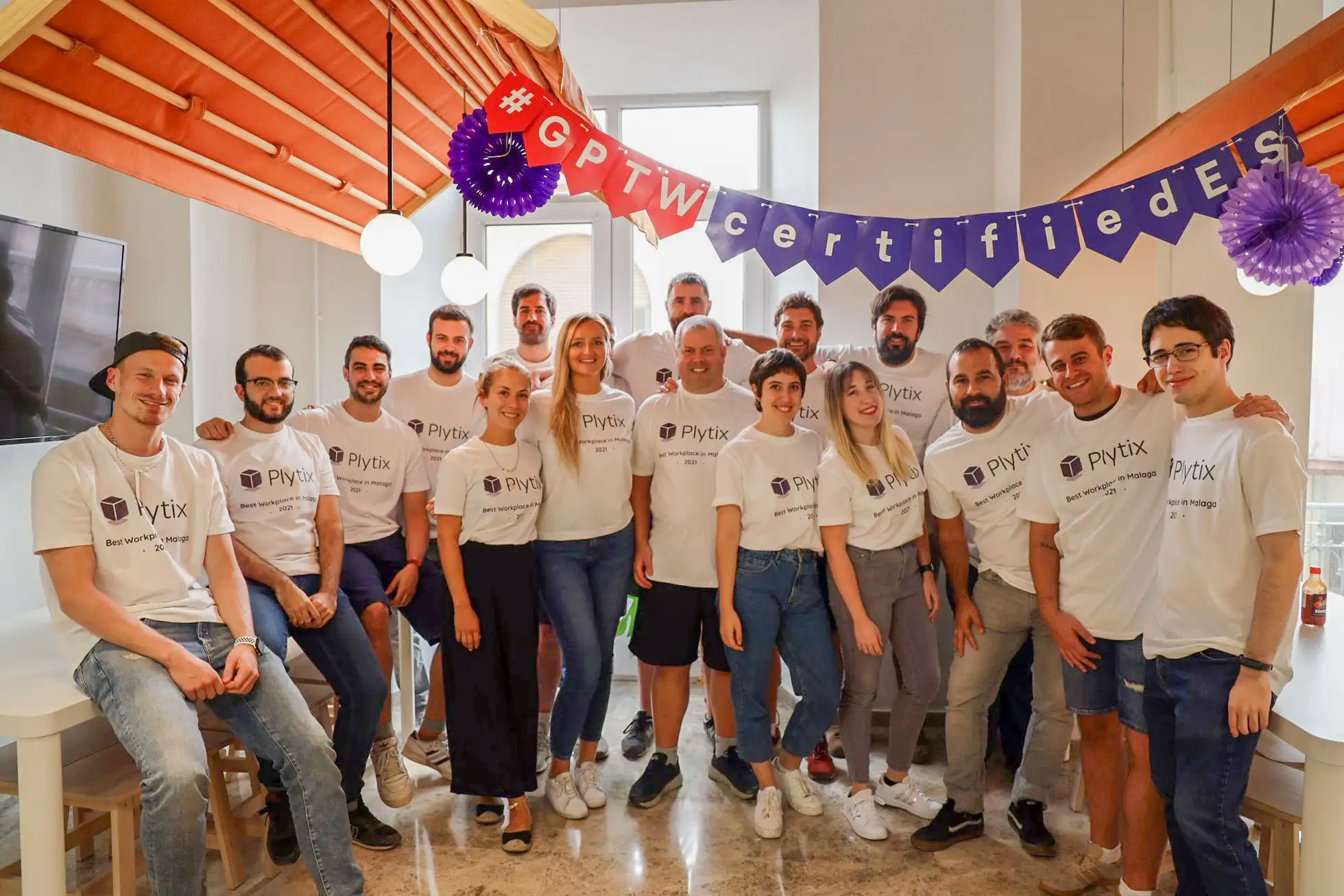 Plytix team in a photo after being recognized as the #1 Best Workplace in Málaga, Spain